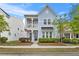 Charming two-story home featuring a balcony, light blue siding, manicured landscaping, and inviting curb appeal at 245 Ribbon Rd, Summerville, SC 29483