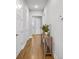 Hallway with a wooden table and plant, leading to various rooms in the house at 245 Ribbon Rd, Summerville, SC 29483