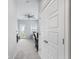 Hallway view with natural light, showing a doorway and a glimpse of the living area at 245 Ribbon Rd, Summerville, SC 29483