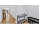 Hallway featuring wood floors, a gray table with decor, and a black storage bench at 245 Ribbon Rd, Summerville, SC 29483