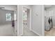 Hallway with doors to rooms, including a bedroom, laundry room, and additional bedroom at 245 Ribbon Rd, Summerville, SC 29483