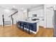 Open kitchen features a large island, stainless appliances, and stairs to the second floor at 245 Ribbon Rd, Summerville, SC 29483