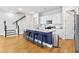 Modern kitchen with white cabinets, stainless steel appliances, and a large island with bar seating at 245 Ribbon Rd, Summerville, SC 29483