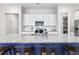 Kitchen island with granite countertop, blue base and seating, accented by white cabinetry at 245 Ribbon Rd, Summerville, SC 29483
