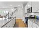 Modern kitchen featuring granite countertops, stainless appliances, and island seating at 245 Ribbon Rd, Summerville, SC 29483