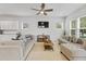 Open-concept living room flowing into a kitchen area, featuring comfortable seating and neutral decor at 245 Ribbon Rd, Summerville, SC 29483