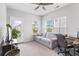 Versatile living space featuring a sofa, desk, and ample natural light from windows and a door at 245 Ribbon Rd, Summerville, SC 29483