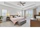 Bright main bedroom with a ceiling fan, two windows, and comfortable furnishings at 245 Ribbon Rd, Summerville, SC 29483