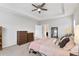 Bright main bedroom with gray walls featuring a ceiling fan, carpet floors, and a large bed at 245 Ribbon Rd, Summerville, SC 29483