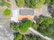 Aerial view of a home's layout, garage, driveway, and surrounding wooded property at 254 Nelson Farm Ln, Cross, SC 29436