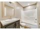 Modern bathroom featuring a vanity with a sleek faucet, a large mirror, and a shower-tub combination with a white surround at 254 Nelson Farm Ln, Cross, SC 29436