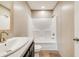 Stylish bathroom with a modern vanity, sleek fixtures, a white toilet, and a tub shower combination against neutral walls at 254 Nelson Farm Ln, Cross, SC 29436