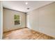 Well-lit bedroom with light walls, wood-look floors, complemented by natural light from a side window at 254 Nelson Farm Ln, Cross, SC 29436