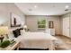 Well-lit bedroom with light walls, wood-look floors, complemented by natural light from a side window at 254 Nelson Farm Ln, Cross, SC 29436