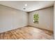 Cozy bedroom with neutral walls, wood-look floors, and a window providing natural light and a view of the outside at 254 Nelson Farm Ln, Cross, SC 29436