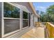 Charming home featuring a cozy porch, modern windows, and an inviting entryway with a 'Welcome' mat at 254 Nelson Farm Ln, Cross, SC 29436