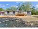 Charming single-story home with traditional style siding and a wood porch and stairs at 254 Nelson Farm Ln, Cross, SC 29436