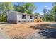 Charming home featuring a wooden porch, complementing the light gray siding and dark shutter accents at 254 Nelson Farm Ln, Cross, SC 29436