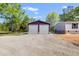 Two-car garage with a gravel driveway, next to a cozy home at 254 Nelson Farm Ln, Cross, SC 29436