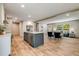 Bright open concept kitchen with a center island that includes bar stool seating and stainless steel appliances at 254 Nelson Farm Ln, Cross, SC 29436