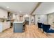 Bright open concept kitchen with a center island that includes bar stool seating and stainless steel appliances at 254 Nelson Farm Ln, Cross, SC 29436