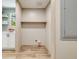 Functional laundry room with built-in shelving and available hookups for a washer and dryer at 254 Nelson Farm Ln, Cross, SC 29436