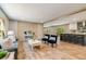 Spacious open concept living room with light wood floors, dining area and view into the kitchen at 254 Nelson Farm Ln, Cross, SC 29436