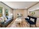 Inviting living room with stylish furniture, light wood floors, and modern paneled accent wall at 254 Nelson Farm Ln, Cross, SC 29436