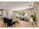 Bright and spacious living room with light wood floors, comfortable seating, and view of the yard at 254 Nelson Farm Ln, Cross, SC 29436