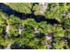 Aerial view of home and waterways, surrounded by lush trees and foliage at 2766 Old Oak Walk, Seabrook Island, SC 29455