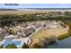 An aerial shot features a recreational complex with a pool, verdant lawn, and ample parking at 2766 Old Oak Walk, Seabrook Island, SC 29455