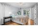 Cozy bedroom with hardwood floors, natural light, and a decorative metal bed frame at 2766 Old Oak Walk, Seabrook Island, SC 29455
