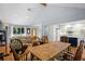 Inviting open-plan living room with a dining area, hardwood floors, and a neutral color scheme that creates a serene ambiance at 2766 Old Oak Walk, Seabrook Island, SC 29455