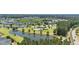 Beautiful aerial view of community, pool and amenities surrounded by lush landscaping, pond and community homes at 278 Decatur Dr, Summerville, SC 29483