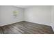 Bright, airy bedroom featuring sleek wood-look flooring and a sunlit window at 278 Decatur Dr, Summerville, SC 29483