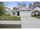 Charming single-story home with gray siding, well-manicured lawn, and an attached two-car garage at 278 Decatur Dr, Summerville, SC 29483