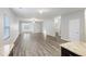 Inviting living room showcasing wood-look floors, neutral walls, and an open layout into adjacent rooms at 278 Decatur Dr, Summerville, SC 29483