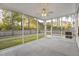 Enjoy outdoor living on this screened porch with ceiling fan and views of the fenced yard at 278 Decatur Dr, Summerville, SC 29483