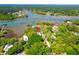 Beautiful coastal home with access to the water surrounded by lush landscape and private dock at 29 Morrison Ave, McClellanville, SC 29458