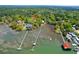 This aerial highlights waterfront homes with private docks along a serene waterway at 29 Morrison Ave, McClellanville, SC 29458