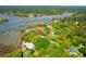 Wonderful aerial view of waterfront homes surrounded by lush trees and marshes at 29 Morrison Ave, McClellanville, SC 29458