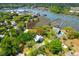 Stunning aerial view of coastal home surrounded by lush greenery, with private dock access at 29 Morrison Ave, McClellanville, SC 29458