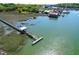 Breathtaking aerial view of the marsh and waterfront area with long pier and various boats at 29 Morrison Ave, McClellanville, SC 29458