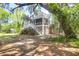 Charming home in wooded lot with lush landscaping at 29 Morrison Ave, McClellanville, SC 29458
