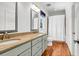 Bright bathroom featuring double sinks, stone countertops, and modern fixtures at 29 Morrison Ave, McClellanville, SC 29458