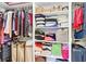 Organized walk-in closet with shelving and ample storage for clothing and luggage at 29 Morrison Ave, McClellanville, SC 29458