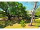 Aerial view of a house surrounded by lush trees and a long driveway at 29 Morrison Ave, McClellanville, SC 29458