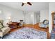 Spacious living room with area rug, hardwood floors, and comfortable seating at 29 Morrison Ave, McClellanville, SC 29458