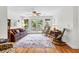 Comfortable living room with access to a balcony, natural light, and ceiling fan at 29 Morrison Ave, McClellanville, SC 29458