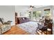 Cozy living room featuring a fireplace, natural light, and hardwood floors at 29 Morrison Ave, McClellanville, SC 29458